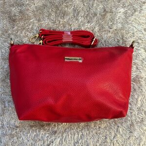 BCBG Paris red pebbles faux leather crossbody.